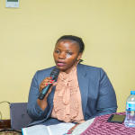 A member of the TCRA Content Committee, Dr. Mary Kafyome, makes her point during the dissemination session for regulators in Dar es Salaam.