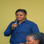 A lecturer from the Open University of Tanzania (OUT), Dr Dachi Kahenga, makes a point during the dissemination session in Dar es Salaam.